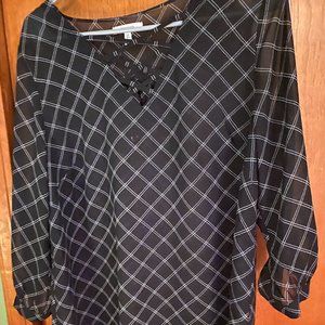 Black and white windowpane patterned shirt made of sheer material